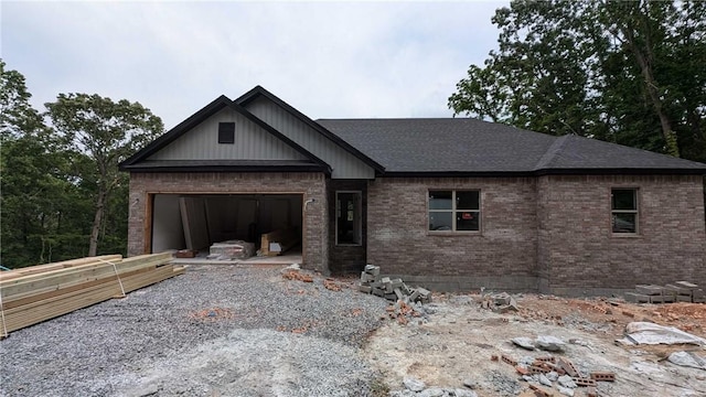 6 Osborne Ln, Bella Vista, AR 72715 - view of front of property featuring a garage, roof with shingles, brick siding, and driveway