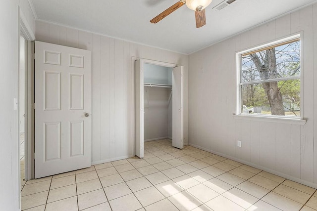 5694/925668/665644/42 W Michael Cole Dr, Fayetteville, AR 72704 - unfurnished bedroom featuring light tile patterned flooring, crown molding, a closet, and visible vents