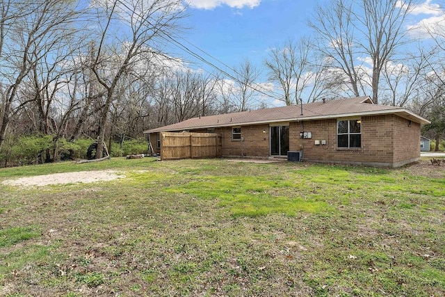 5694/925668/665644/42 W Michael Cole Dr, Fayetteville, AR 72704 - rear view of house with brick siding, central AC, and a yard