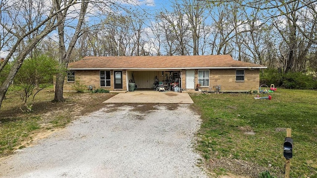 5694/925668/665644/42 W Michael Cole Dr, Fayetteville, AR 72704 - ranch-style house with gravel driveway, brick siding, an attached carport, and a front lawn