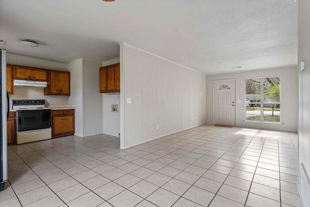 5694/925668/665644/42 W Michael Cole Dr, Fayetteville, AR 72704 - kitchen featuring under cabinet range hood, range with electric cooktop, brown cabinets, and light tile patterned floors