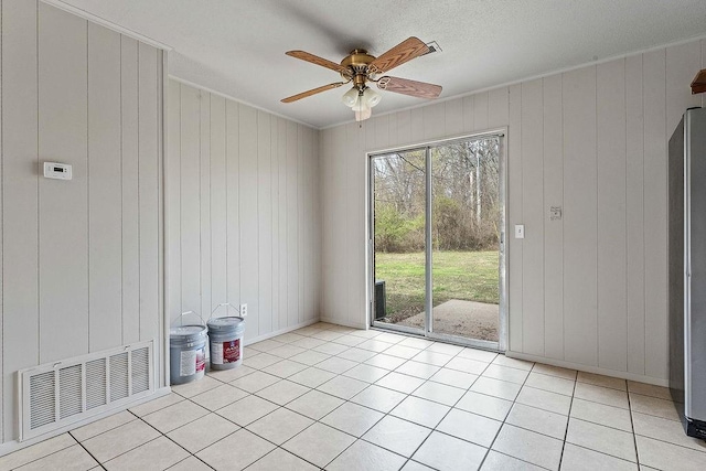 5694/925668/665644/42 W Michael Cole Dr, Fayetteville, AR 72704 - unfurnished room with light tile patterned floors, ornamental molding, visible vents, and a ceiling fan
