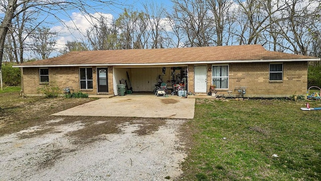 5694/925668/665644/42 W Michael Cole Dr, Fayetteville, AR 72704 - ranch-style house featuring an attached carport, a front yard, brick siding, and driveway