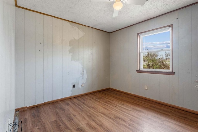 5694/925668/665644/42 W Michael Cole Dr, Fayetteville, AR 72704 - spare room featuring crown molding, wood finished floors, a textured ceiling, baseboards, and ceiling fan