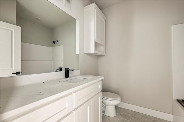 7 Boreray Ln, Bella Vista, AR 72715 - bathroom with toilet, tile patterned floors, a shower, vanity, and baseboards