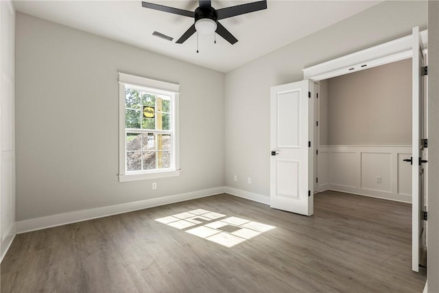 7 Boreray Ln, Bella Vista, AR 72715 - unfurnished bedroom featuring wood finished floors, baseboards, and a ceiling fan