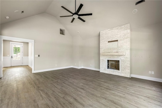 7 Boreray Ln, Bella Vista, AR 72715 - unfurnished living room featuring ceiling fan, high vaulted ceiling, wood finished floors, and a fireplace