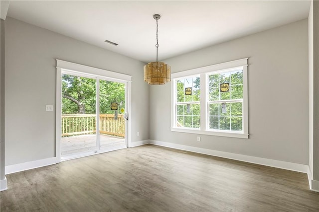 7 Boreray Ln, Bella Vista, AR 72715 - empty room with a chandelier, wood finished floors, and baseboards