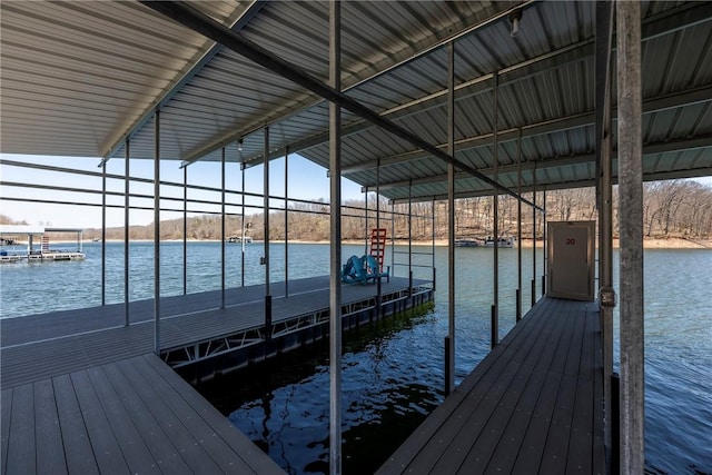 view of dock with boat lift and a water view