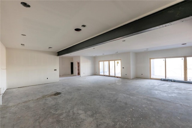 spare room featuring concrete flooring