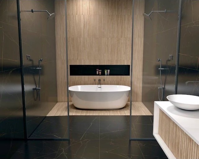full bathroom featuring a freestanding bath, vanity, tiled shower, and marble finish floor