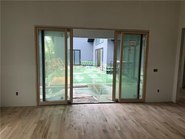 doorway to outside featuring wood finished floors