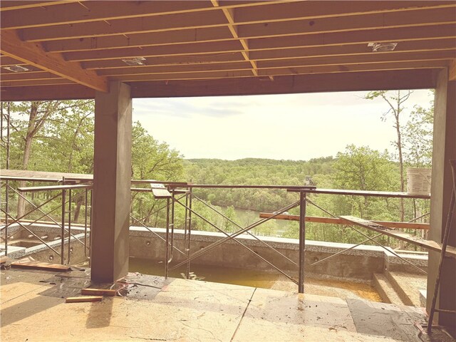 exterior space featuring a forest view