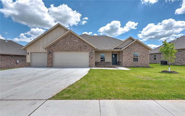 98 N Banner Ave, Farmington, AR 72730 - view of front facade featuring board and batten siding, central AC unit, a front lawn, a garage, and driveway