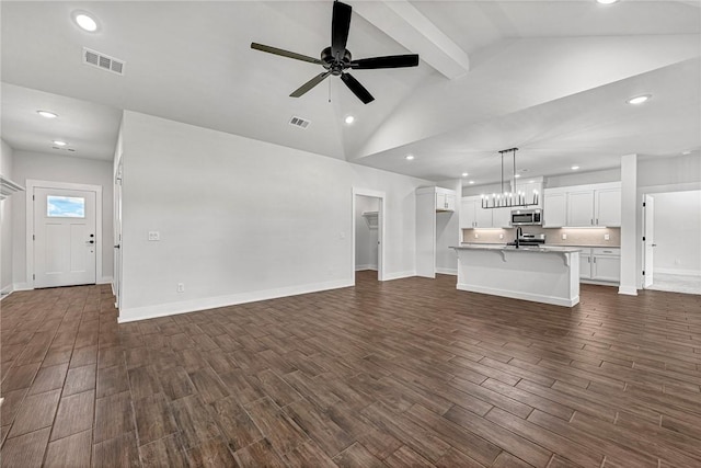 98 N Banner Ave, Farmington, AR 72730 - unfurnished living room with ceiling fan, dark wood-style flooring, beam ceiling, recessed lighting, and baseboards