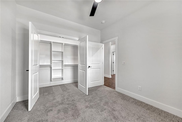 98 N Banner Ave, Farmington, AR 72730 - unfurnished bedroom with carpet, baseboards, a closet, and a ceiling fan