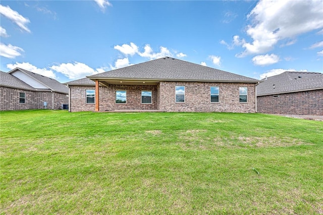 98 N Banner Ave, Farmington, AR 72730 - back of property featuring a yard and brick siding