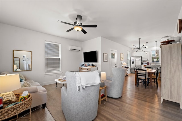 845 One Mile Rd, Fayetteville, AR 72704 - living room featuring a wall unit AC, ceiling fan, dark wood finished floors, baseboards, and a chandelier