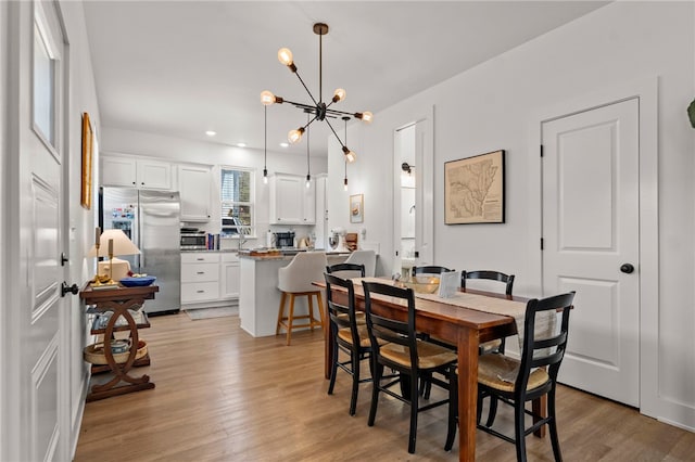 845 One Mile Rd, Fayetteville, AR 72704 - dining space featuring a chandelier, light wood-type flooring, and recessed lighting