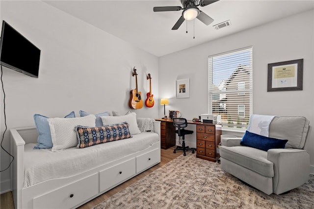 845 One Mile Rd, Fayetteville, AR 72704 - bedroom featuring wood finished floors, a ceiling fan, and an office area