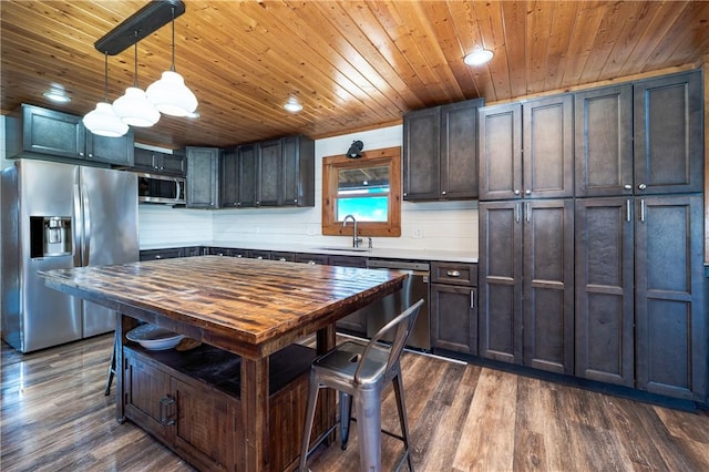 kitchen featuring a sink, wooden ceiling, appliances with stainless steel finishes, and dark wood-type flooring