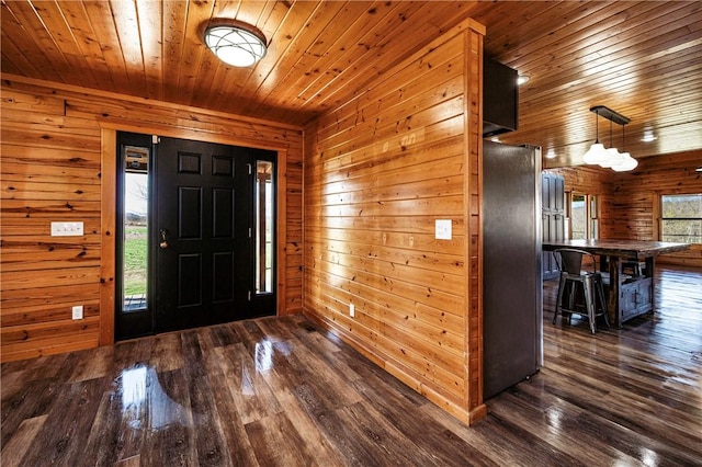 entrance foyer with wooden ceiling, dark wood-type flooring, and a wealth of natural light