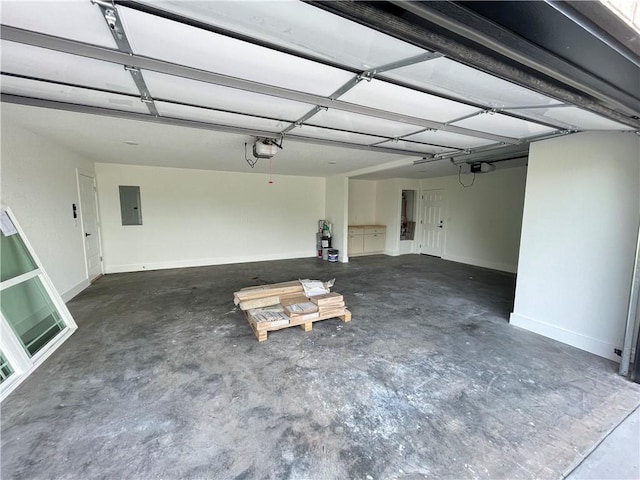 13040 Seba Rd, Centerton, AR 72719 - garage featuring electric panel, a garage door opener, and baseboards