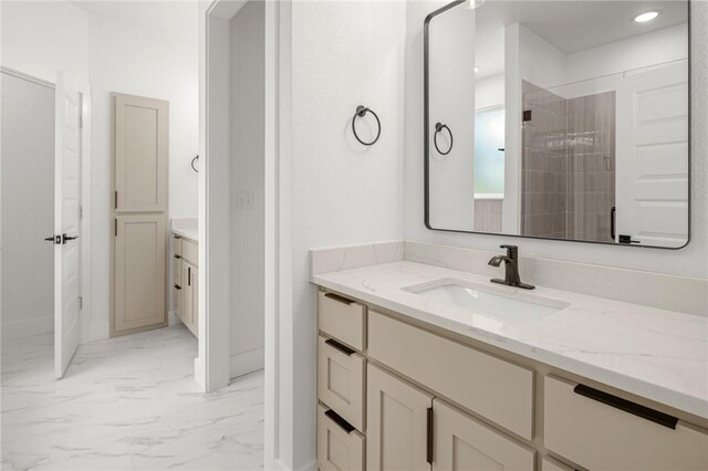 13040 Seba Rd, Centerton, AR 72719 - full bathroom featuring marble look tile flooring, vanity, recessed lighting, baseboards, and tiled shower