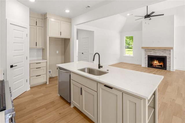 13040 Seba Rd, Centerton, AR 72719 - kitchen with a sink, dishwasher, light wood-style floors, ceiling fan, and lofted ceiling