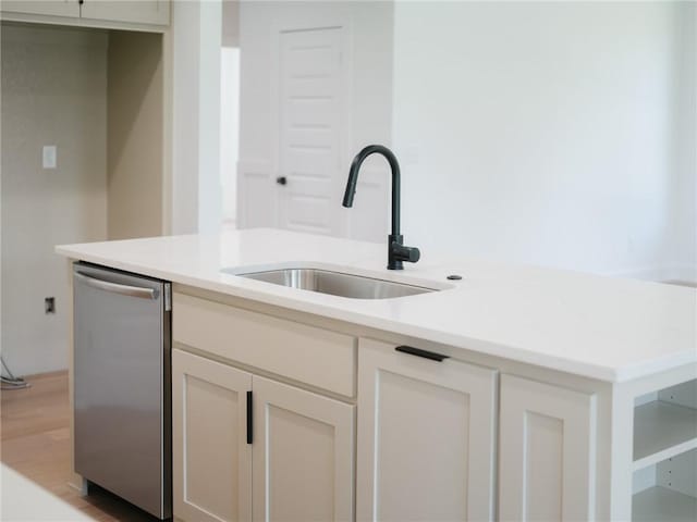 13040 Seba Rd, Centerton, AR 72719 - kitchen featuring a sink, stainless steel dishwasher, light countertops, and light wood finished floors