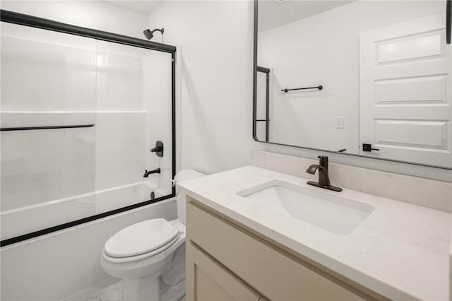 13040 Seba Rd, Centerton, AR 72719 - full bathroom featuring toilet, vanity, marble finish flooring, and bath / shower combo with glass door