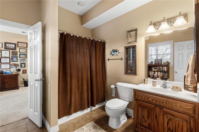 full bathroom featuring vanity, toilet, a shower with shower curtain, baseboards, and tile patterned floors