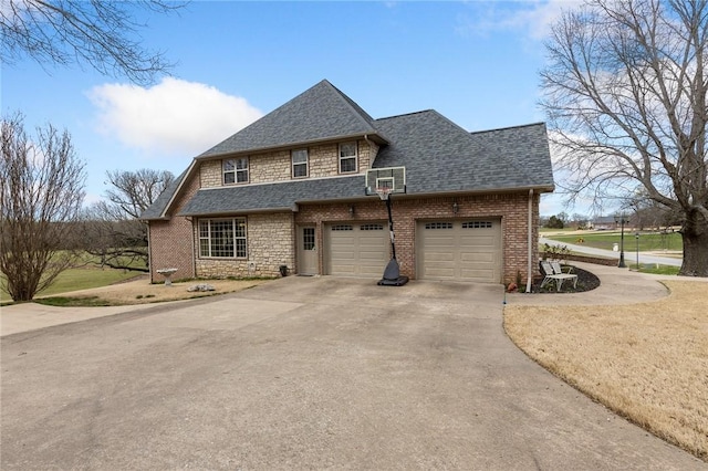 view of front facade with stone siding, brick siding, driveway, and roof with shingles