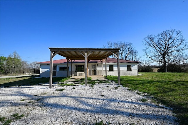12766 Rocky Hill Rd, Prairie Grove, AR 72753 - view of front of home featuring driveway, a front yard, metal roof, and a detached carport