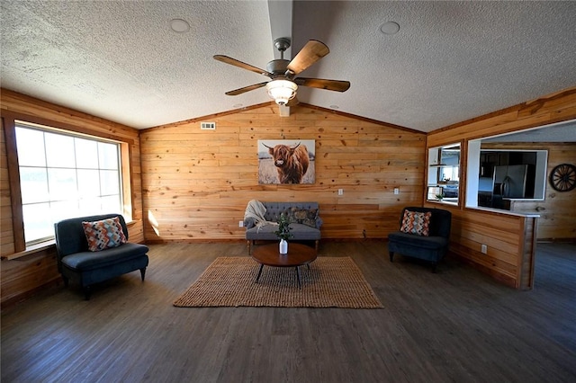 12766 Rocky Hill Rd, Prairie Grove, AR 72753 - unfurnished room with lofted ceiling, visible vents, wood finished floors, and a ceiling fan