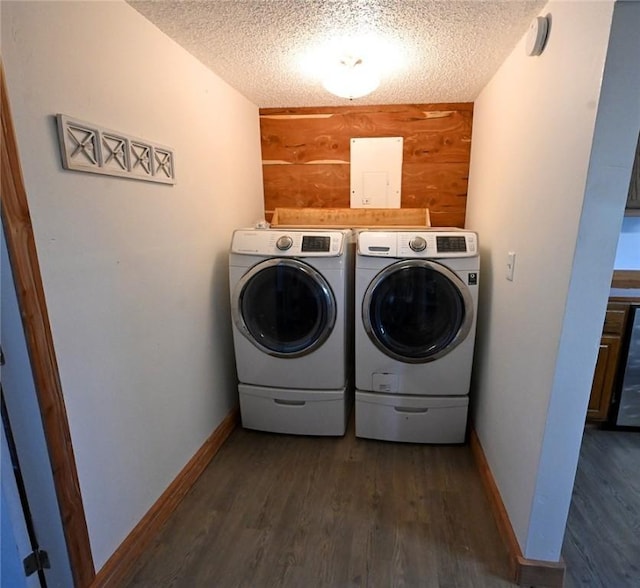 12766 Rocky Hill Rd, Prairie Grove, AR 72753 - clothes washing area with dark wood-type flooring, a textured ceiling, separate washer and dryer, and wooden walls