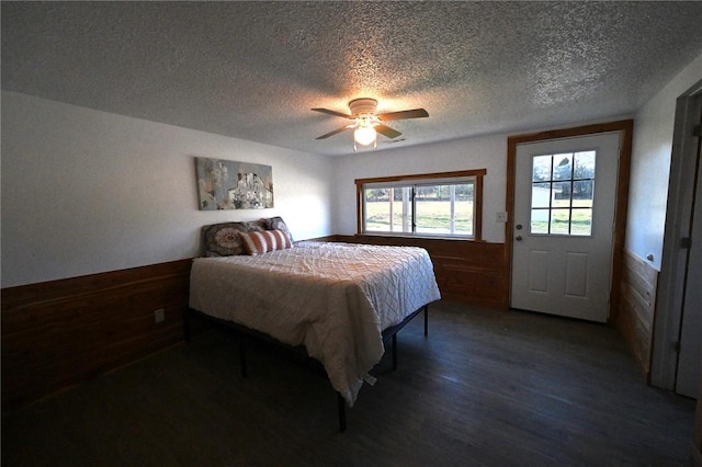 12766 Rocky Hill Rd, Prairie Grove, AR 72753 - bedroom featuring wood finished floors, wooden walls, and wainscoting