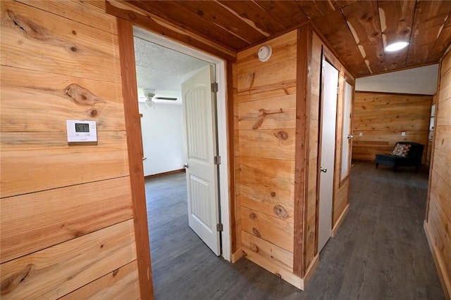 12766 Rocky Hill Rd, Prairie Grove, AR 72753 - corridor featuring wood ceiling, wooden walls, and dark wood finished floors