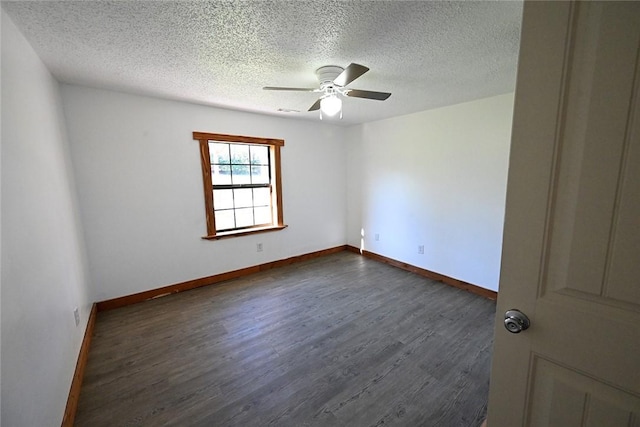 12766 Rocky Hill Rd, Prairie Grove, AR 72753 - empty room featuring baseboards, a textured ceiling, dark wood-style floors, and a ceiling fan