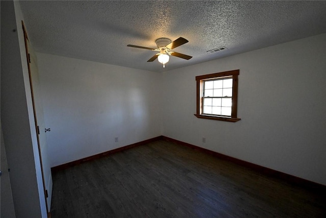 12766 Rocky Hill Rd, Prairie Grove, AR 72753 - empty room with a textured ceiling, visible vents, baseboards, a ceiling fan, and dark wood finished floors