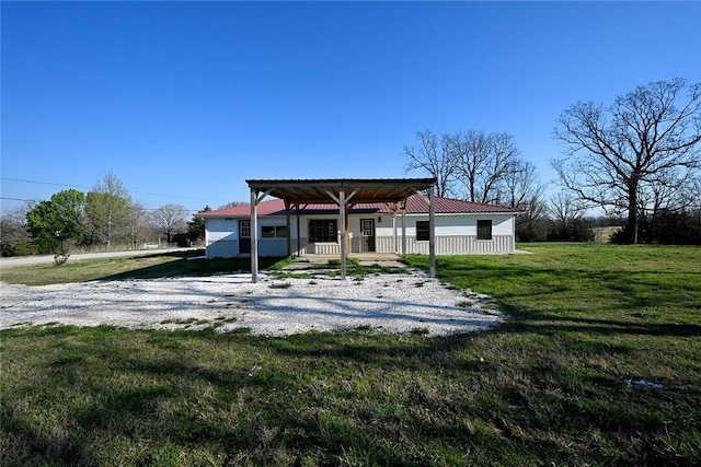 12766 Rocky Hill Rd, Prairie Grove, AR 72753 - back of house with metal roof and a lawn
