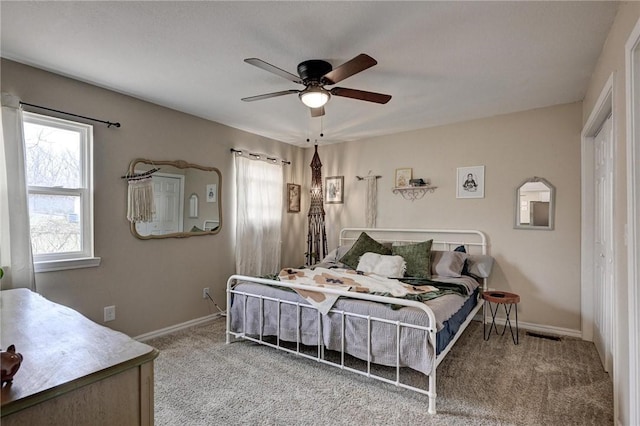 1801 Cash St, Neosho, MO 64850 - bedroom with carpet flooring, visible vents, baseboards, and a ceiling fan