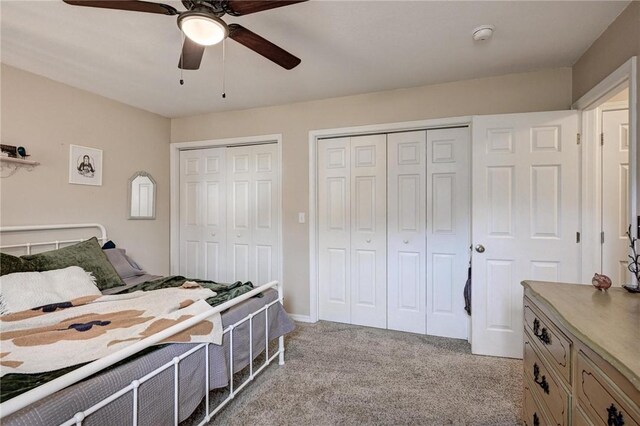 1801 Cash St, Neosho, MO 64850 - carpeted bedroom with a ceiling fan and multiple closets