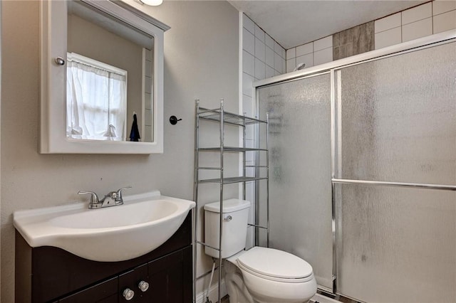 1801 Cash St, Neosho, MO 64850 - bathroom with a shower stall, vanity, and toilet