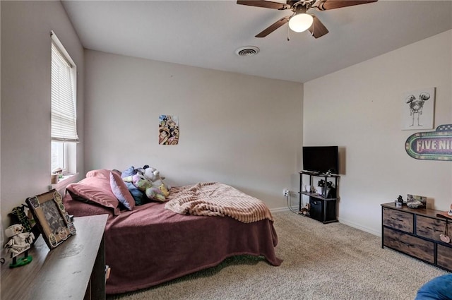 1801 Cash St, Neosho, MO 64850 - carpeted bedroom with a ceiling fan, baseboards, multiple windows, and visible vents