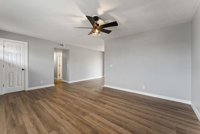 1004 N 30th St, Rogers, AR 72756 - empty room with ceiling fan, baseboards, and dark wood-style flooring