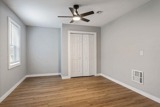 1004 N 30th St, Rogers, AR 72756 - unfurnished bedroom with light wood-type flooring, baseboards, and a closet