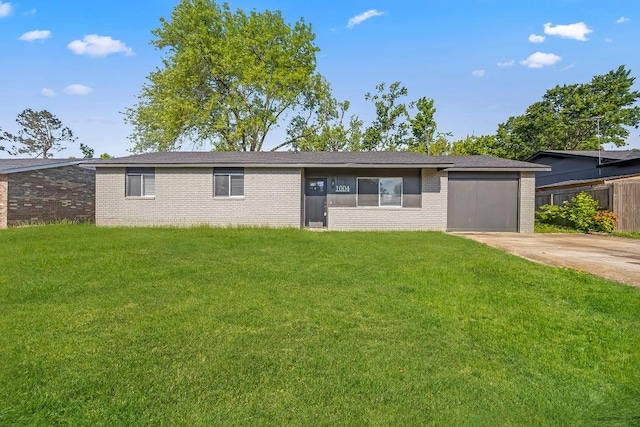 1004 N 30th St, Rogers, AR 72756 - ranch-style house with brick siding, concrete driveway, and a garage