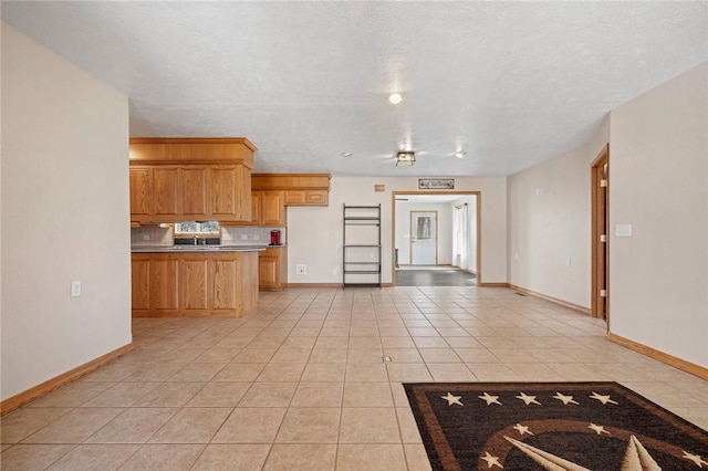 1120 County Road 6012, Berryville, AR 72616 - kitchen featuring baseboards, open floor plan, and light tile patterned floors