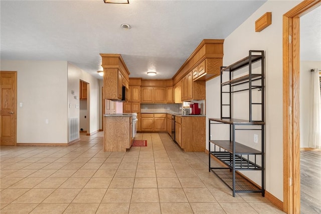 1120 County Road 6012, Berryville, AR 72616 - kitchen with light tile patterned flooring, visible vents, a sink, and dishwasher